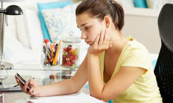 Teen girl looking at mobile phone