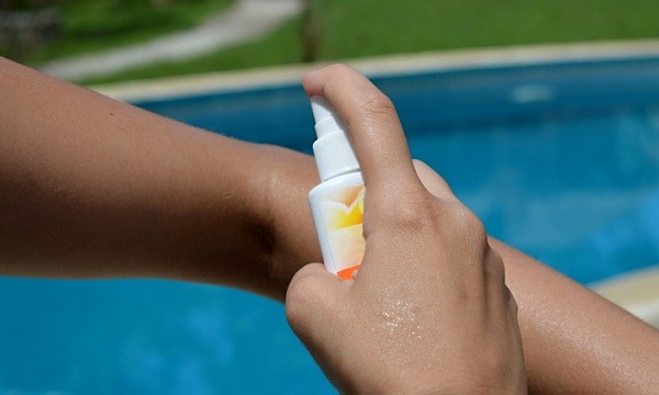 applying insect repellant